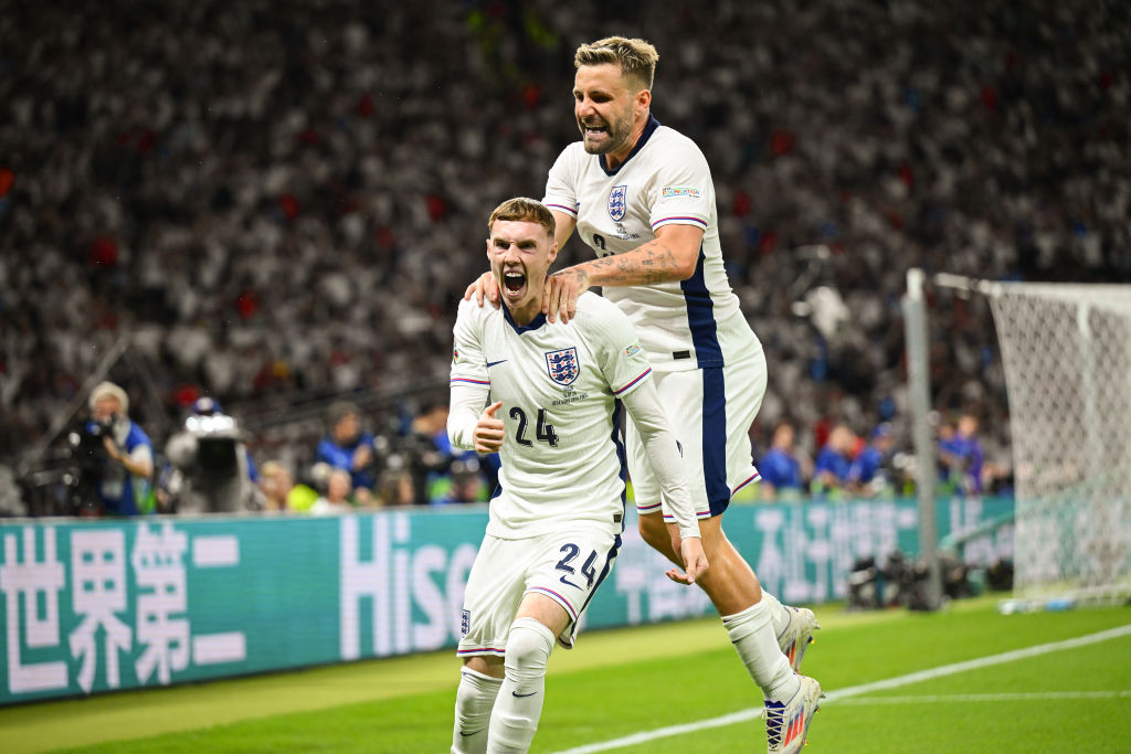 Cole Palmer of England celebrates scoring to make it 1-1 with team mate Luke Shaw during the UEFA EURO 2024 final match between Spain and England